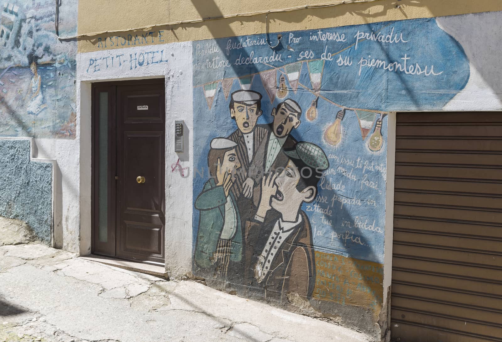Orgosolo,Italy, 6 April 2018 :Murales in Orgosolo Italy Since about 1969 the wall paintings reflect different aspects of Sardinia's political struggles and international issues