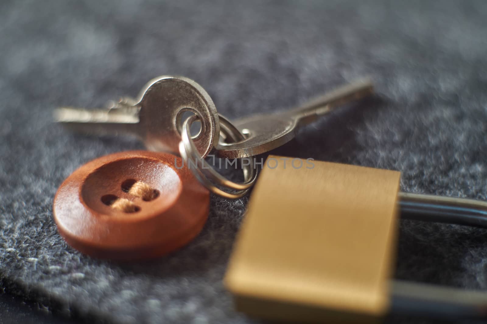 Brass lock, keys playing with light, shadow, reflection and surfaces, selective focus