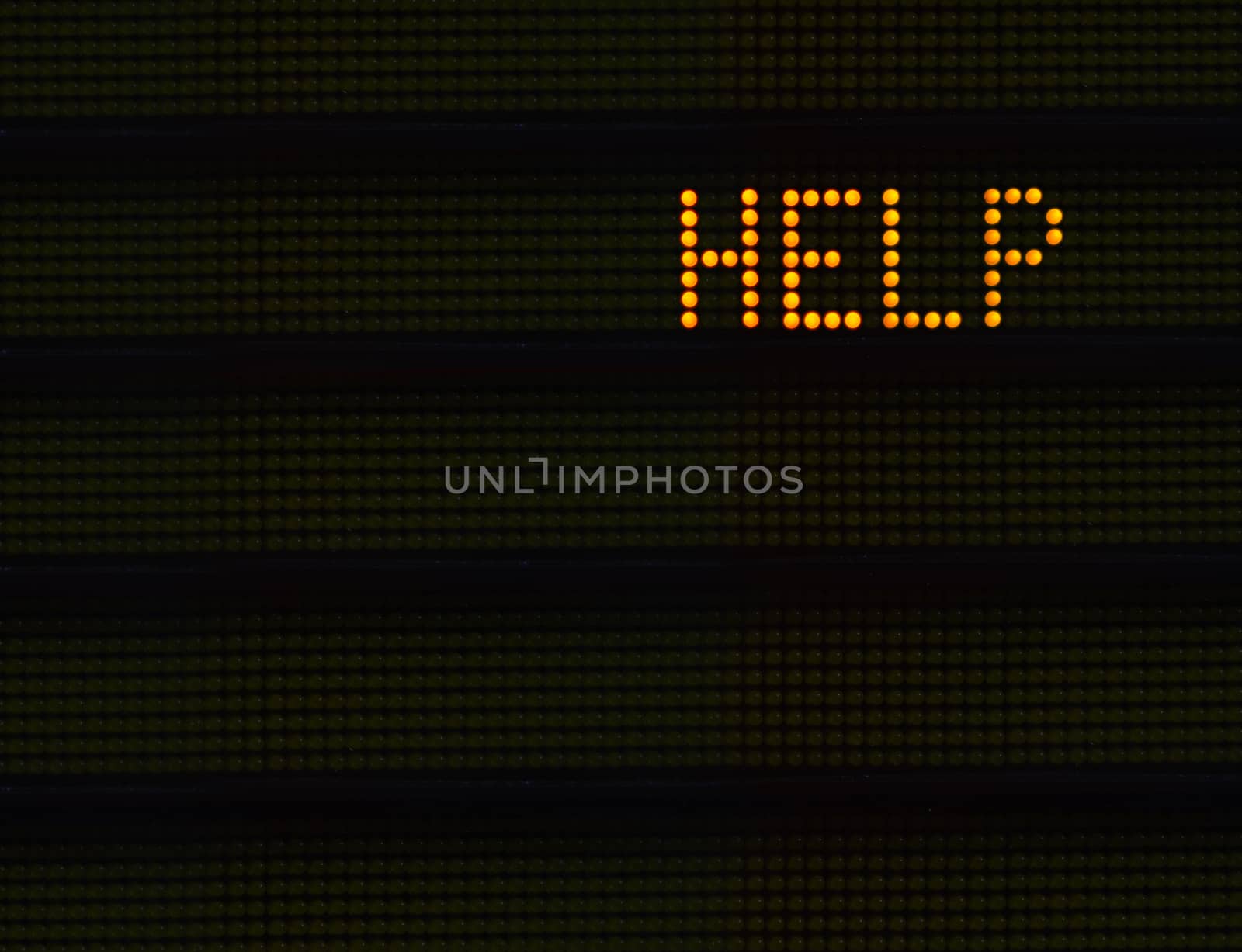 The Word HELP In Orange Lights On A Retro Signboard At An Airport Or Station