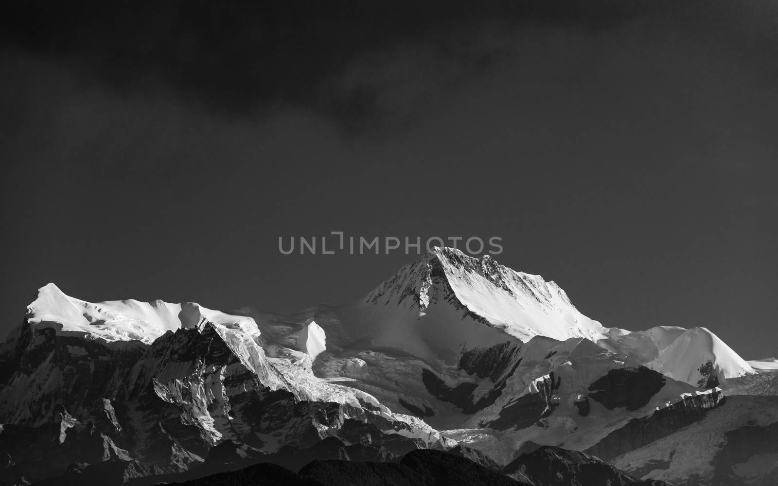 A peak in the Annapurna mountain range, Nepal. Black and white photograph.