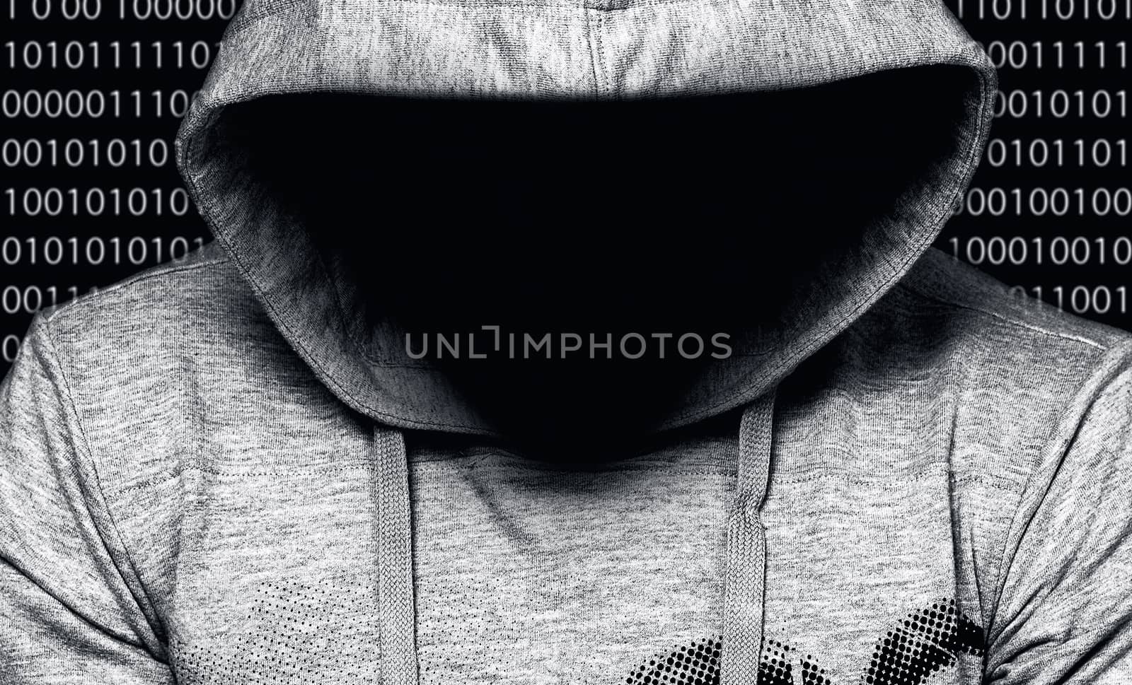 Hacker. Man in hood with face in a darkness with digital numbers by Nobilior