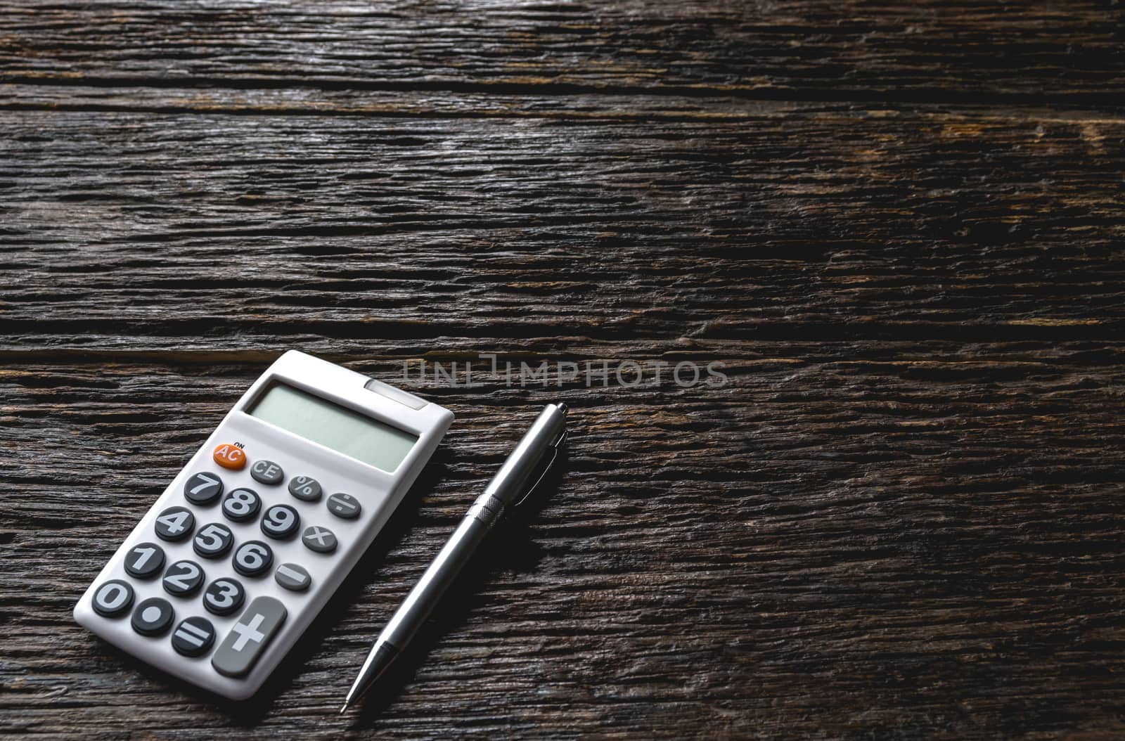Top view of pen with calculator and copy space for insert text.