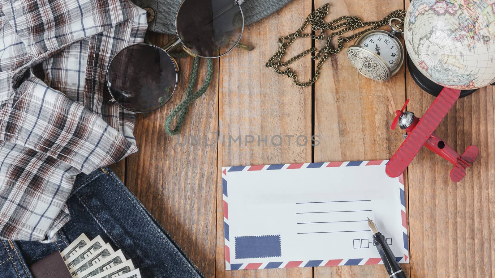 Jeans, Shirt, Passports, Banknote, Sunglasses, Airplane Model, Pocket Watch, Fountain Pen And Envelope Of Cost Of Travel Prepared For The Trip, Travel Accessories Costumer, Vintage Filter by rakoptonLPN