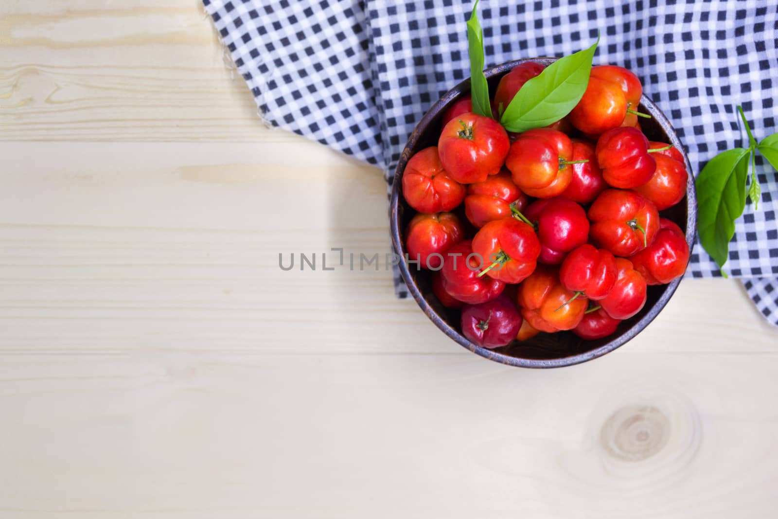 Sweet Cherry Berries In Wooden Bowl With Tartan Fabric On The Table, Red Ripe Juicy Sweet Cherry Lies On Vintage Wooden Background, Flat Lay, Top View And Copyspace For Text, Healthy Fruit Food. by rakoptonLPN