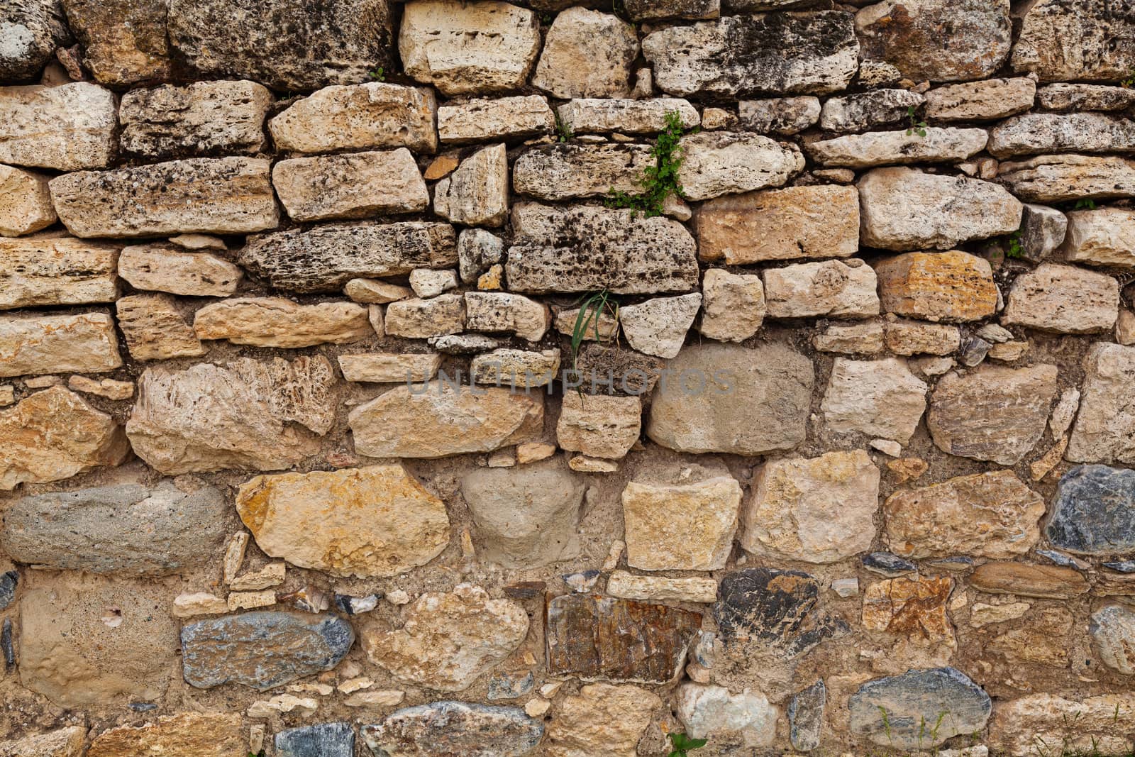 Stone wall in ancient city Hierapolis by igor_stramyk