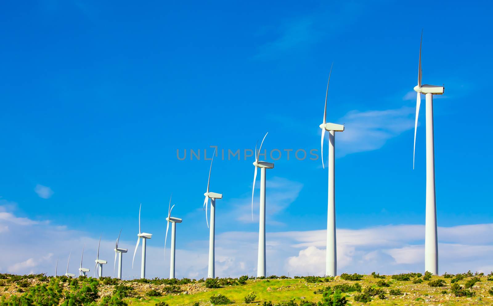 Dramatic Wind Turbine Farm in the Desert of California. by Feverpitched