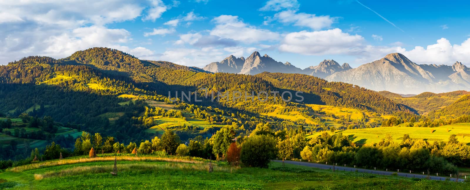 mountainous panorama of countryside at sunrise by Pellinni