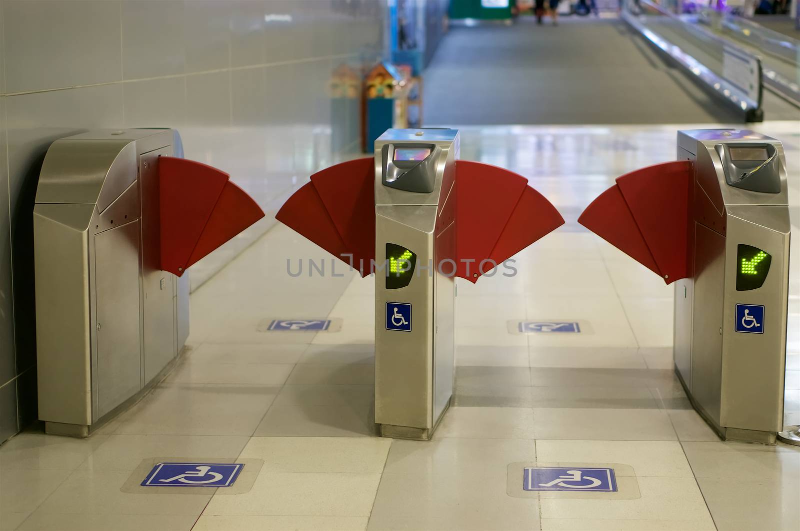 Disabled lane exit of subway electric train station at international airport terminal.