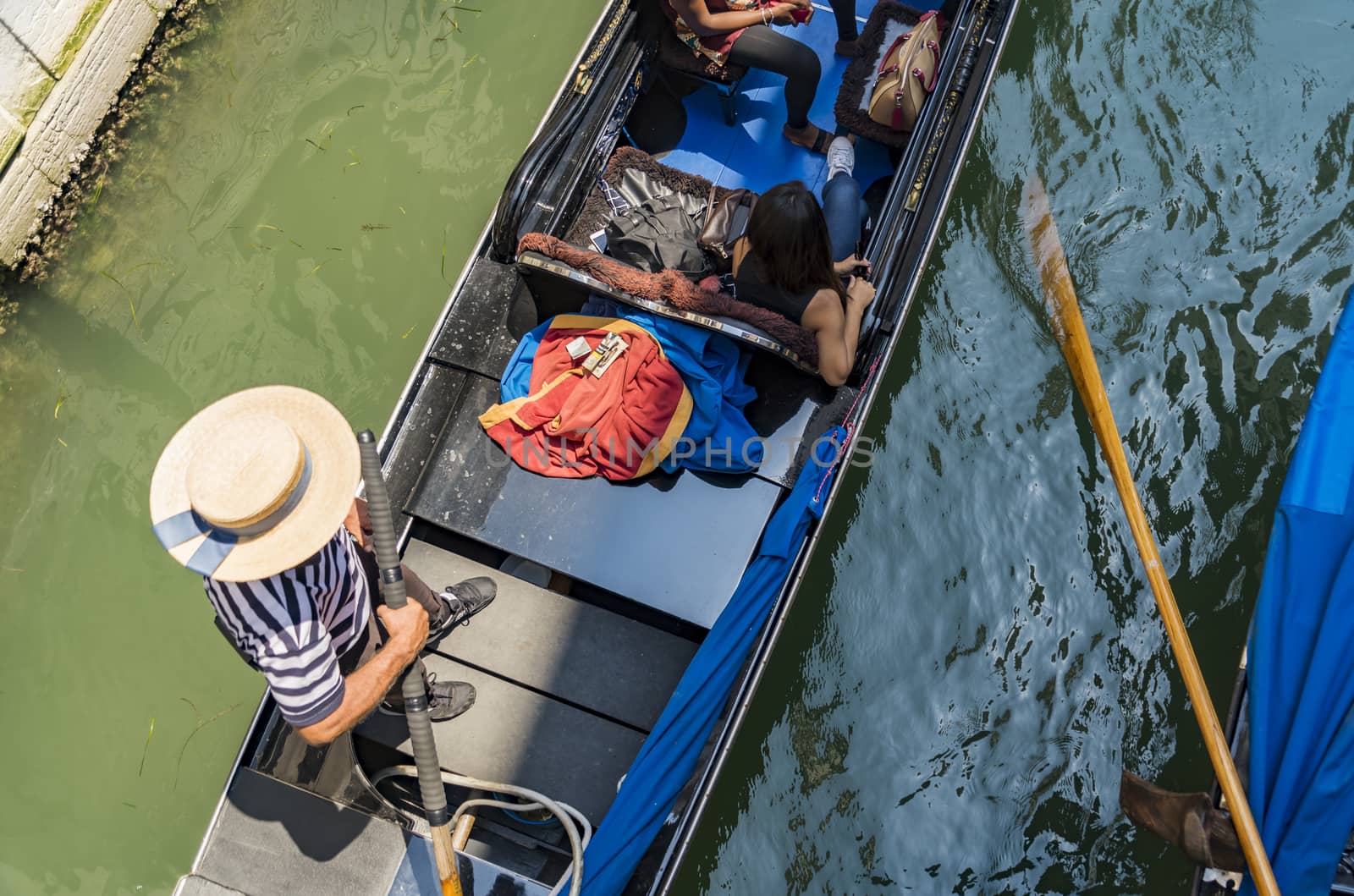 VENICE - JULY 1: beautiful view of the canal with a floating gondola on July 1, 2017 in Venice, Italy