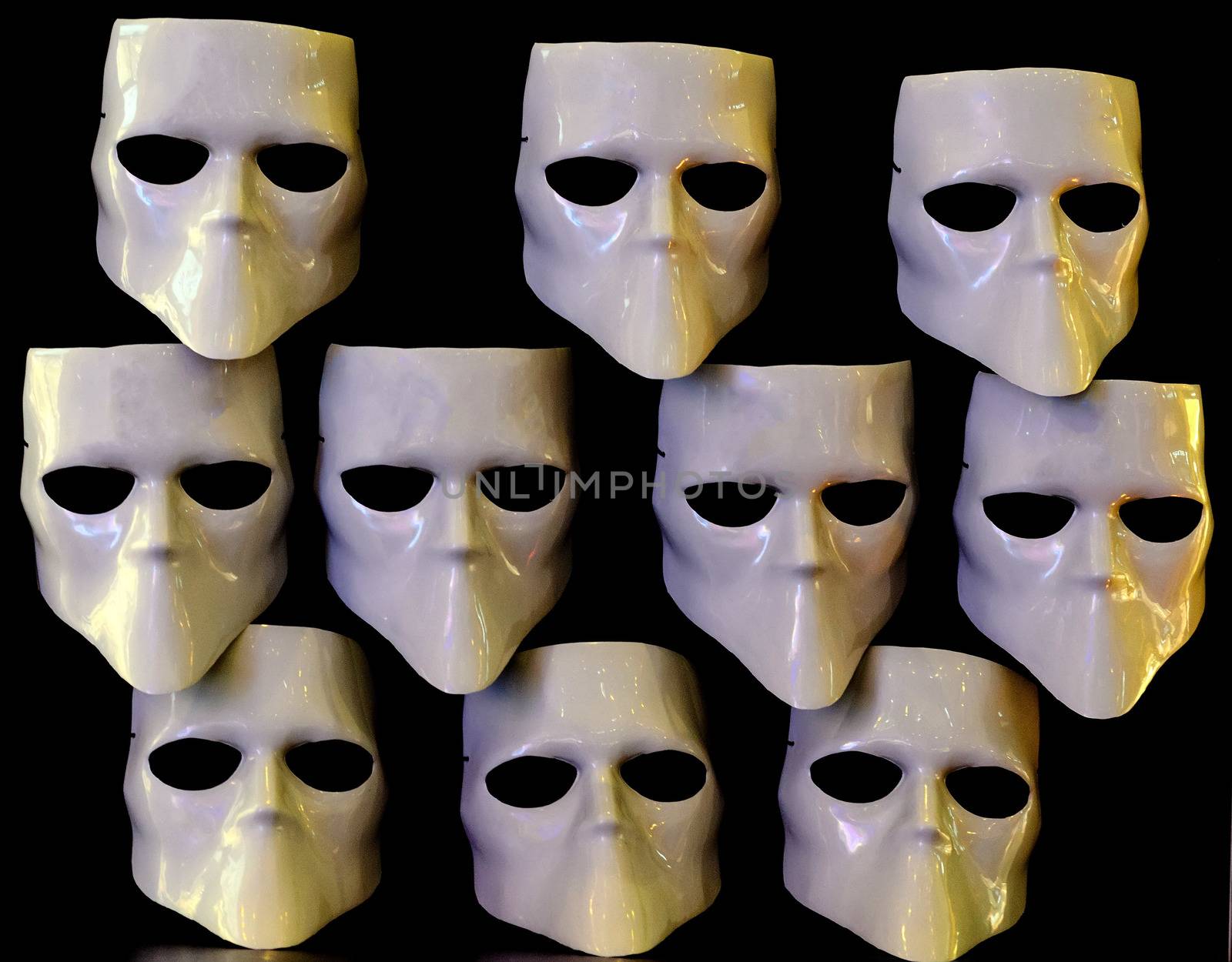 Masks for the faceless on black background.Ten masks.