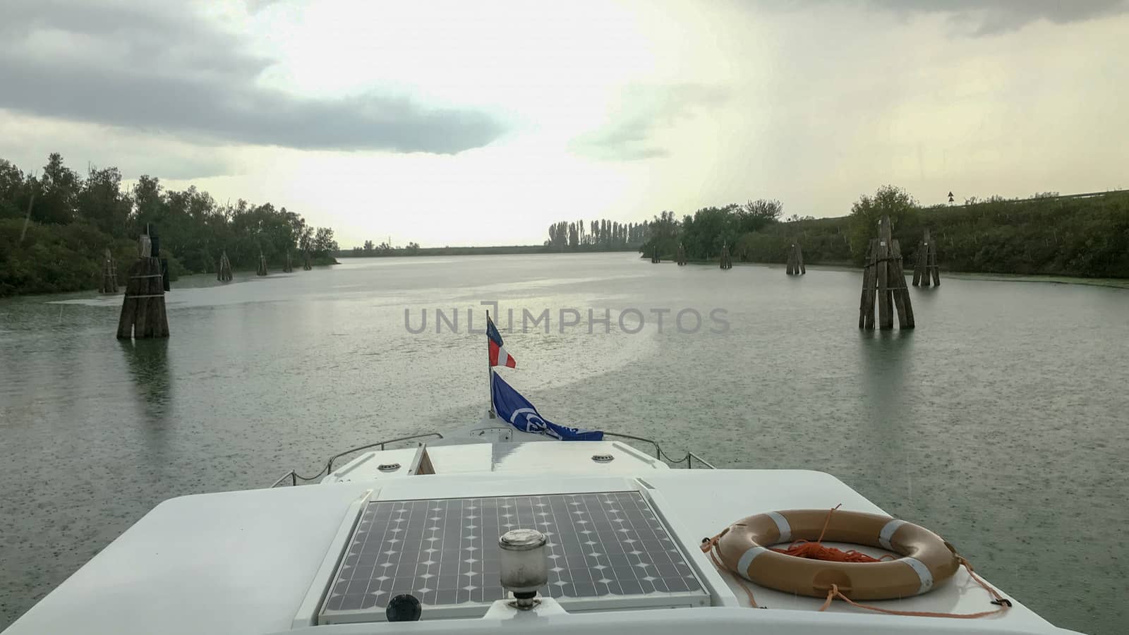 view from the boat to a river in venice at summer