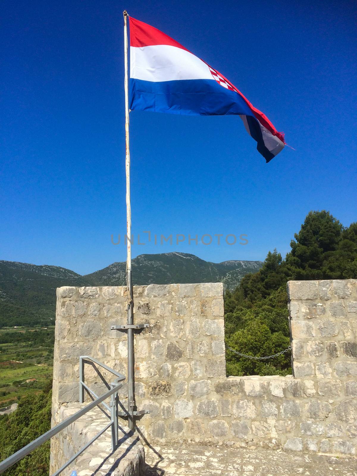 the croatian flag at an old tower by Tevion25