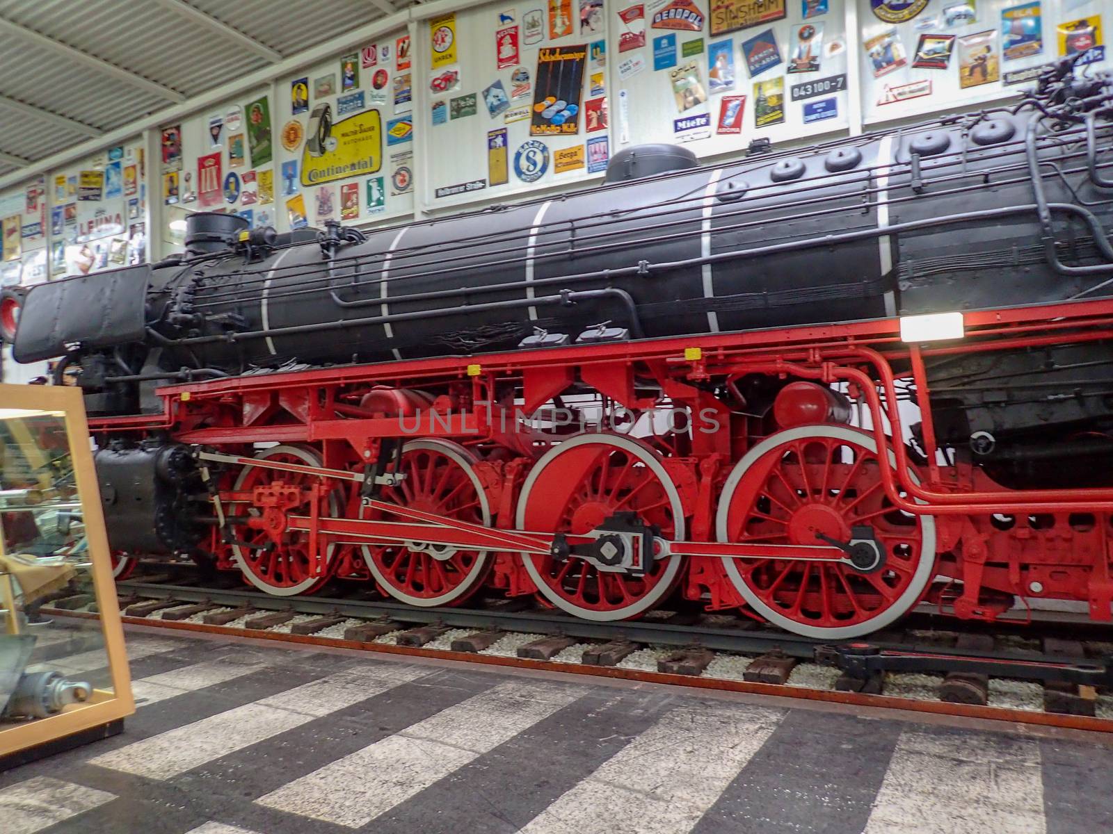 an old steam train in a museum by Tevion25