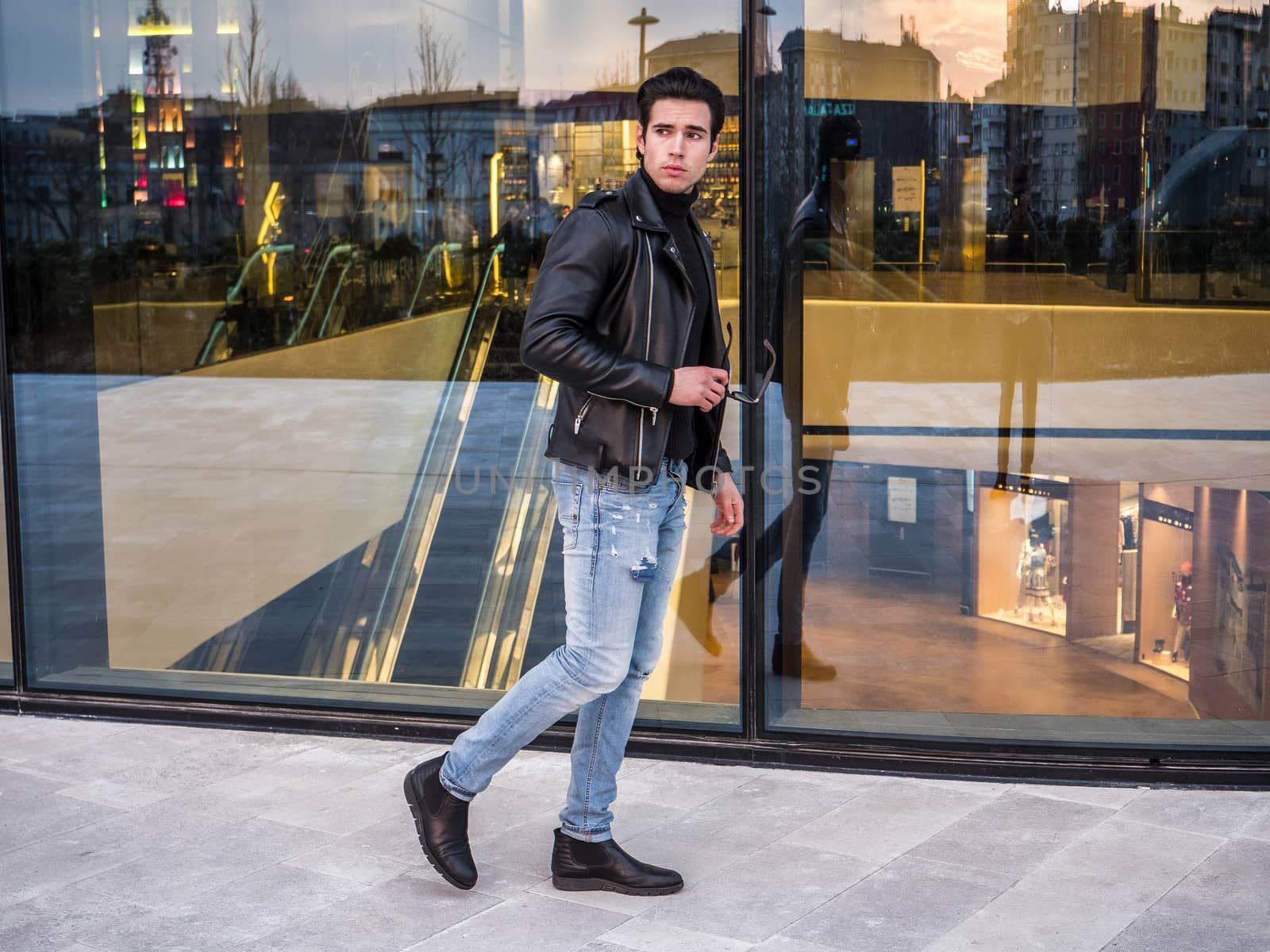 One handsome young man in modern city setting by artofphoto