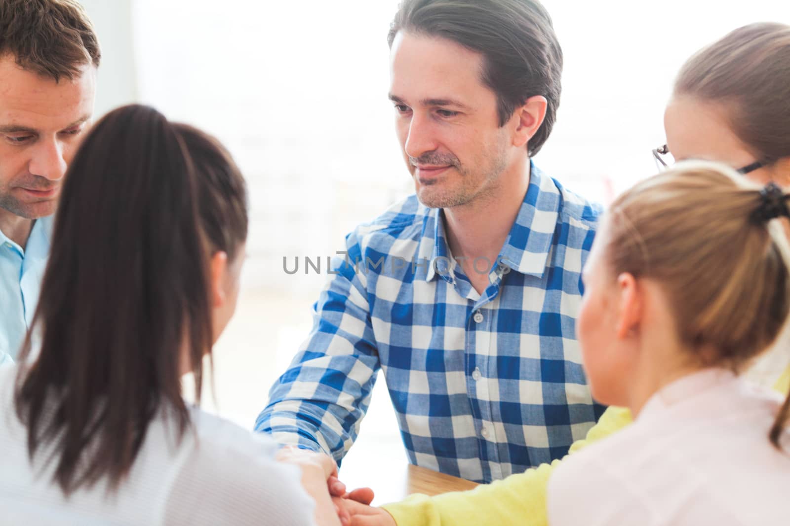 Startup diversity teamwork brainstorming meeting concept, people sitting around the table