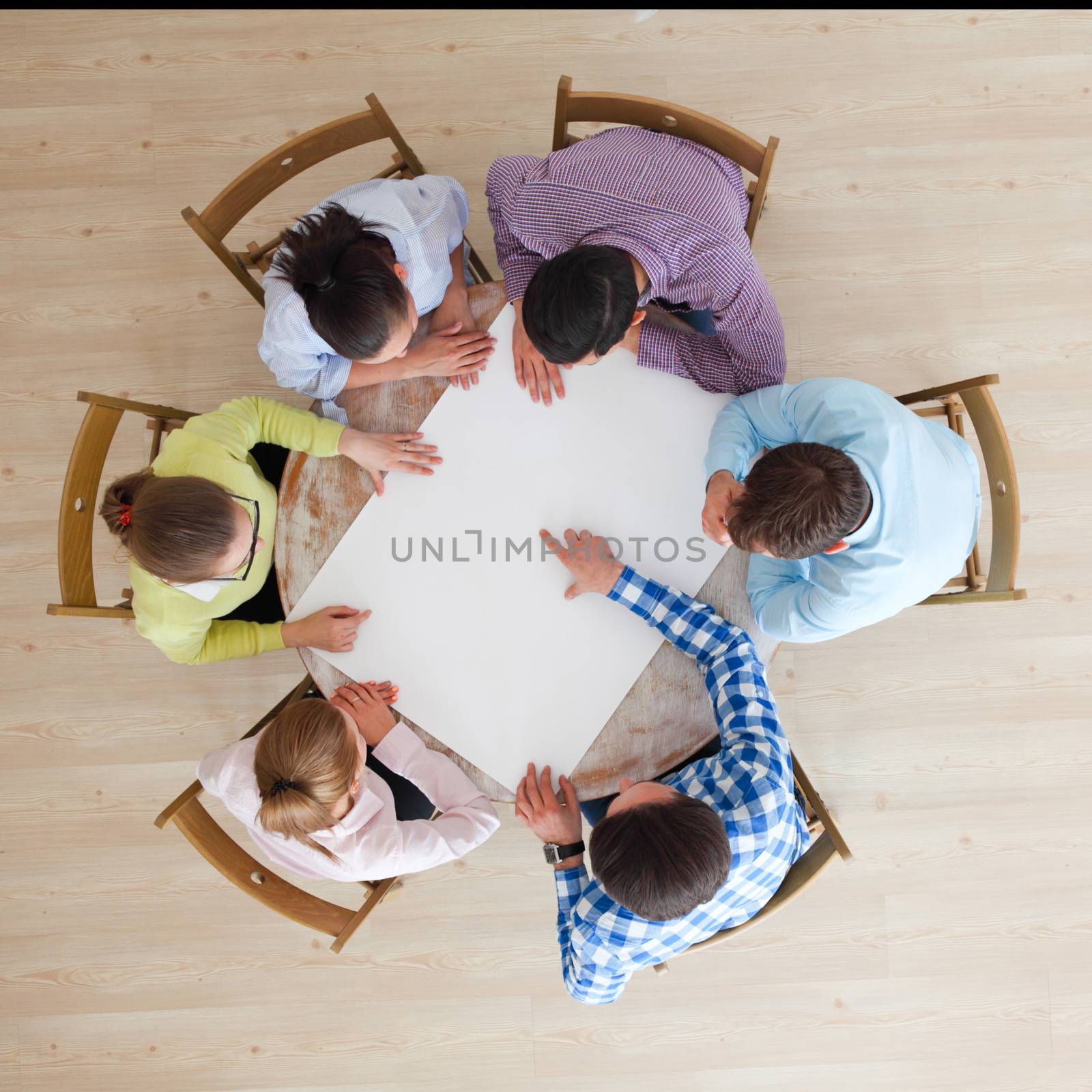 People team pointing to white paper by ALotOfPeople