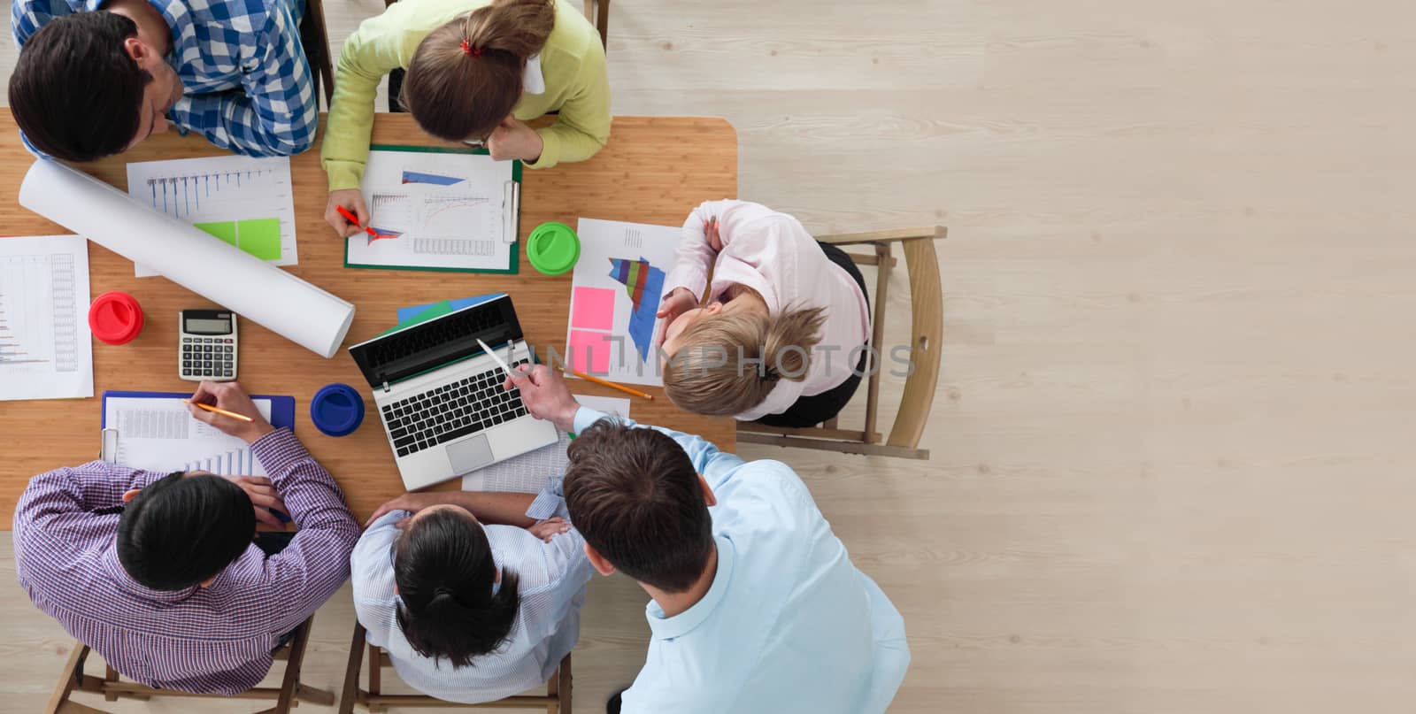 Business team meeting, people in casual clothes working with financial statistics at office desk