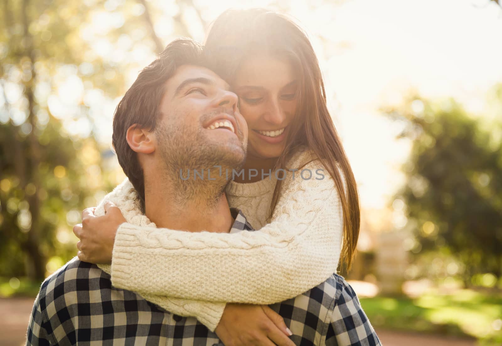 Beautiful couple in the park smiling