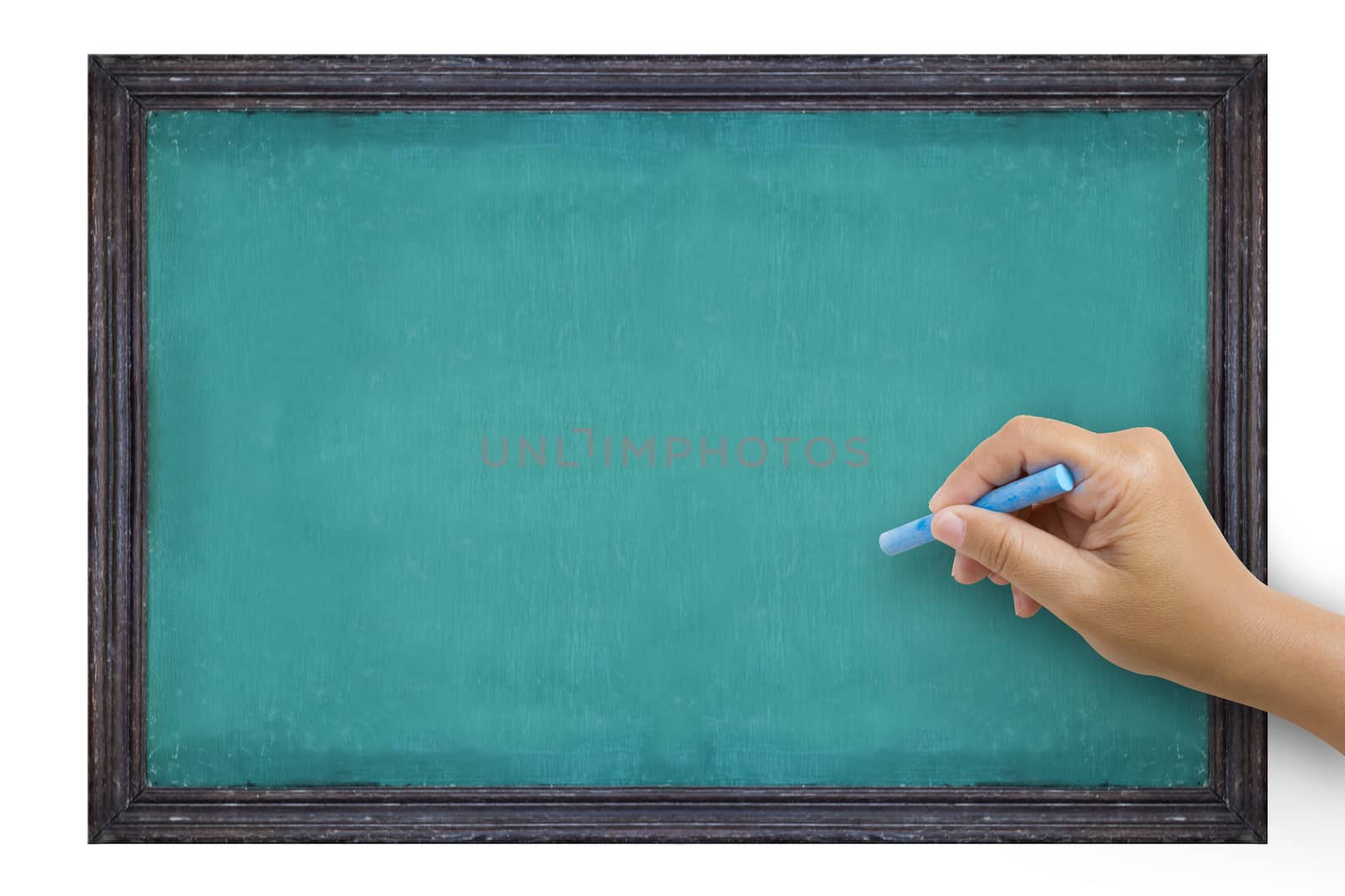 The hand that catches Chalk is preparing to write the alphabet on empty green chalkboard with black wooden frame isolated on white background, vintage wall texture background. 