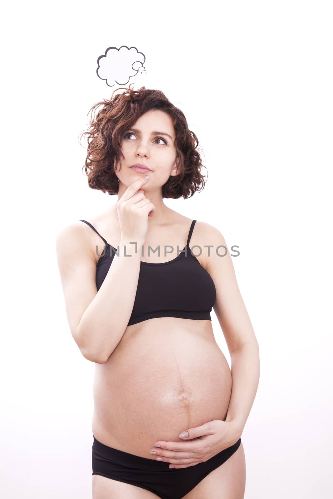 Pregnant woman thinks about her baby. Isolated on white background