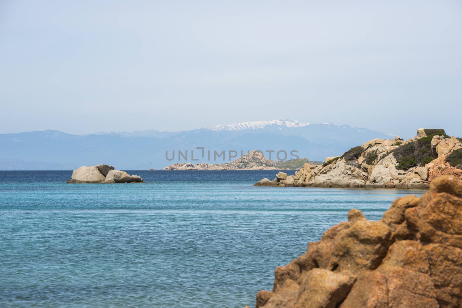 the beautiful island of maddalena , compared with the maledives, with blue sea and the mountains as background, you travel here by ferry from palau