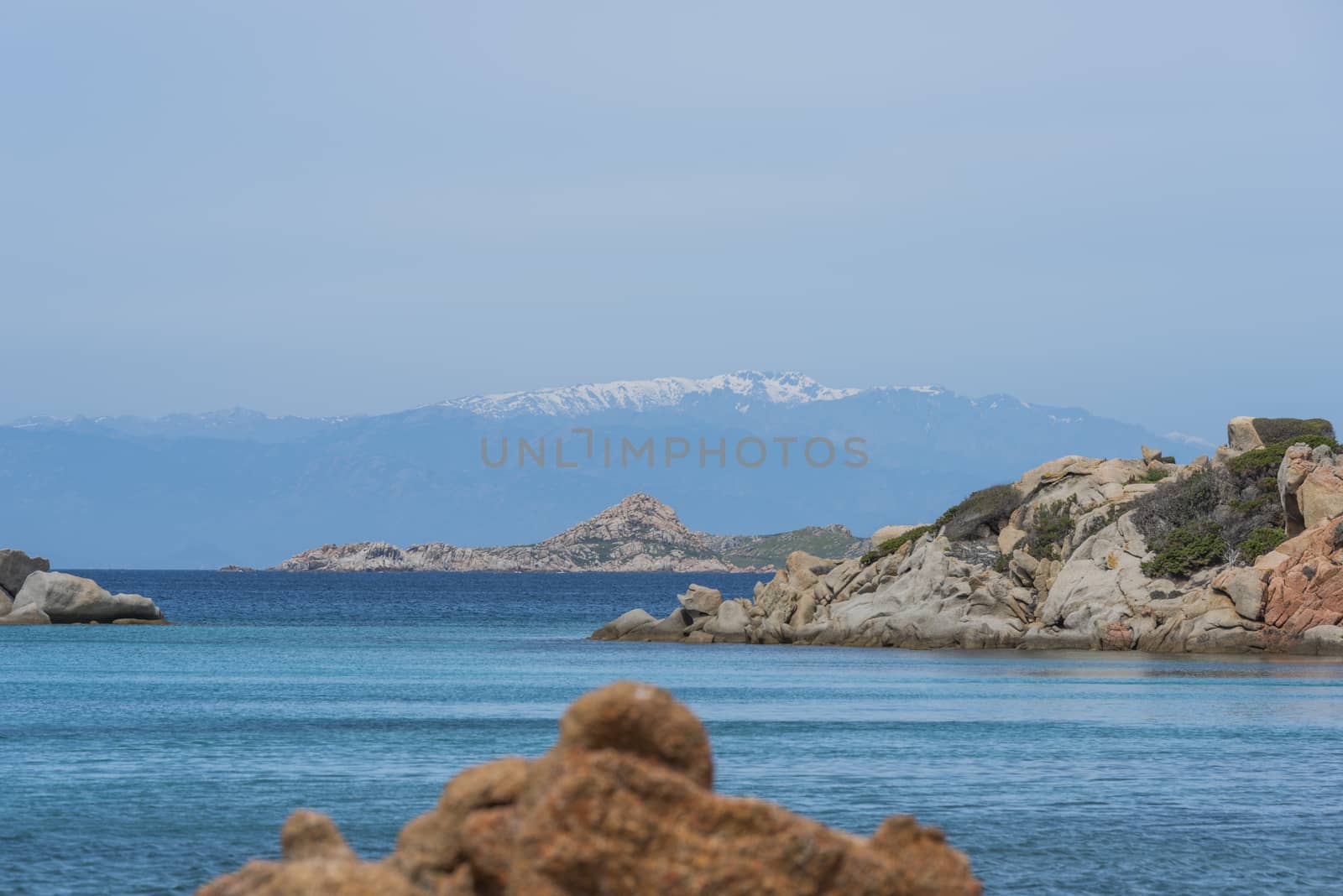 the beautiful island of maddalena , compared with the maledives, with blue sea and the mountains as background, you travel here by ferry from palau