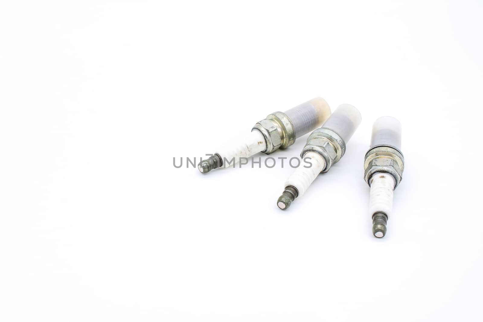 Old spark plug isolated on the white by ahimaone