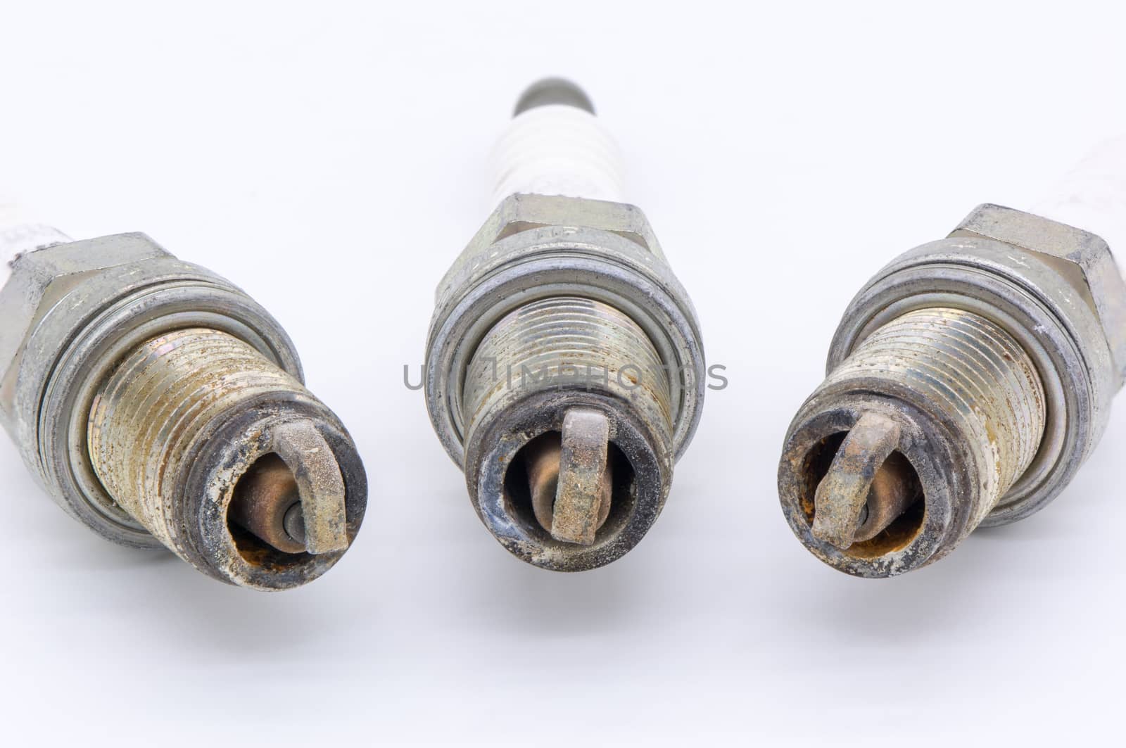 Old spark plug isolated on the white