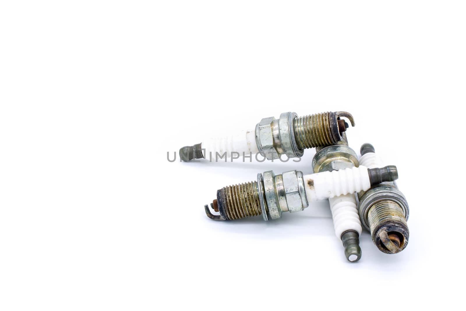 Old spark plug isolated on the white