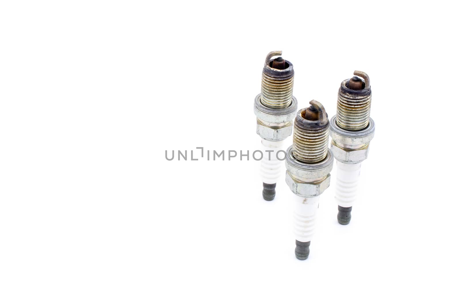 Old spark plug isolated on the white