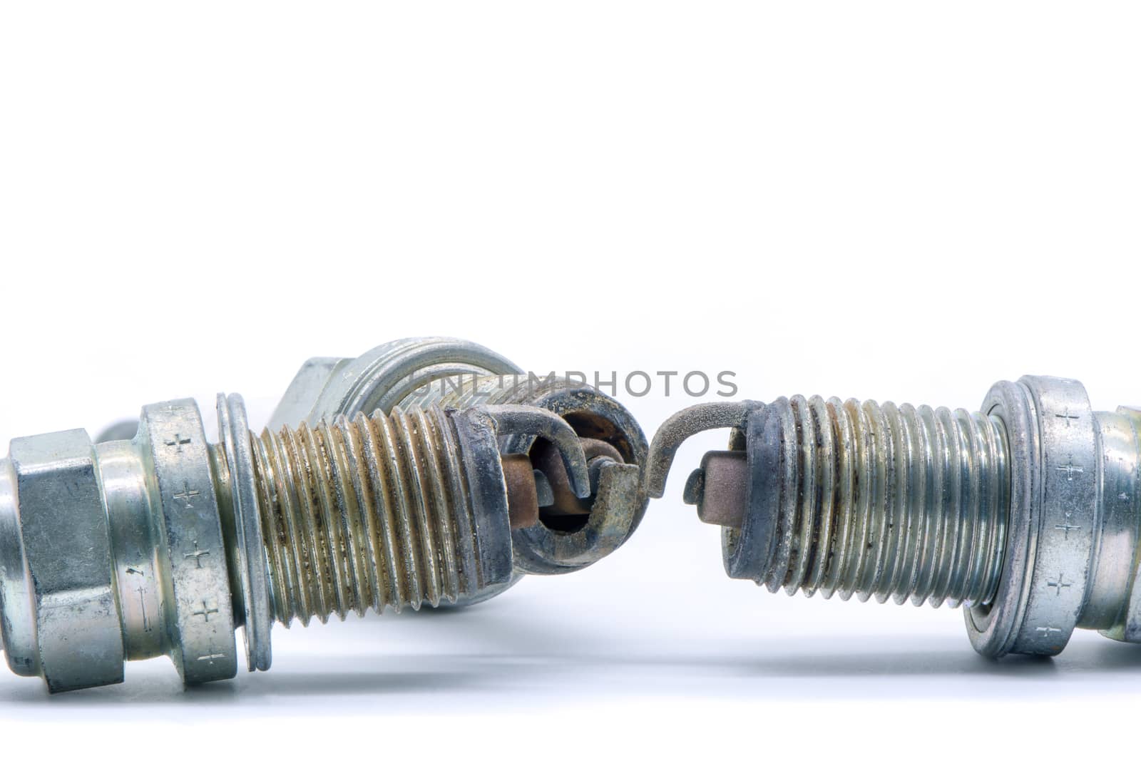 Old spark plug isolated on the white by ahimaone