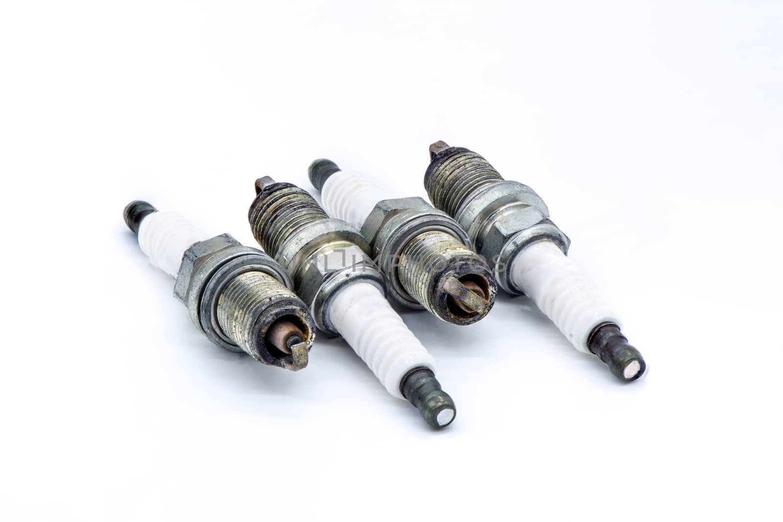 Old spark plug isolated on the white