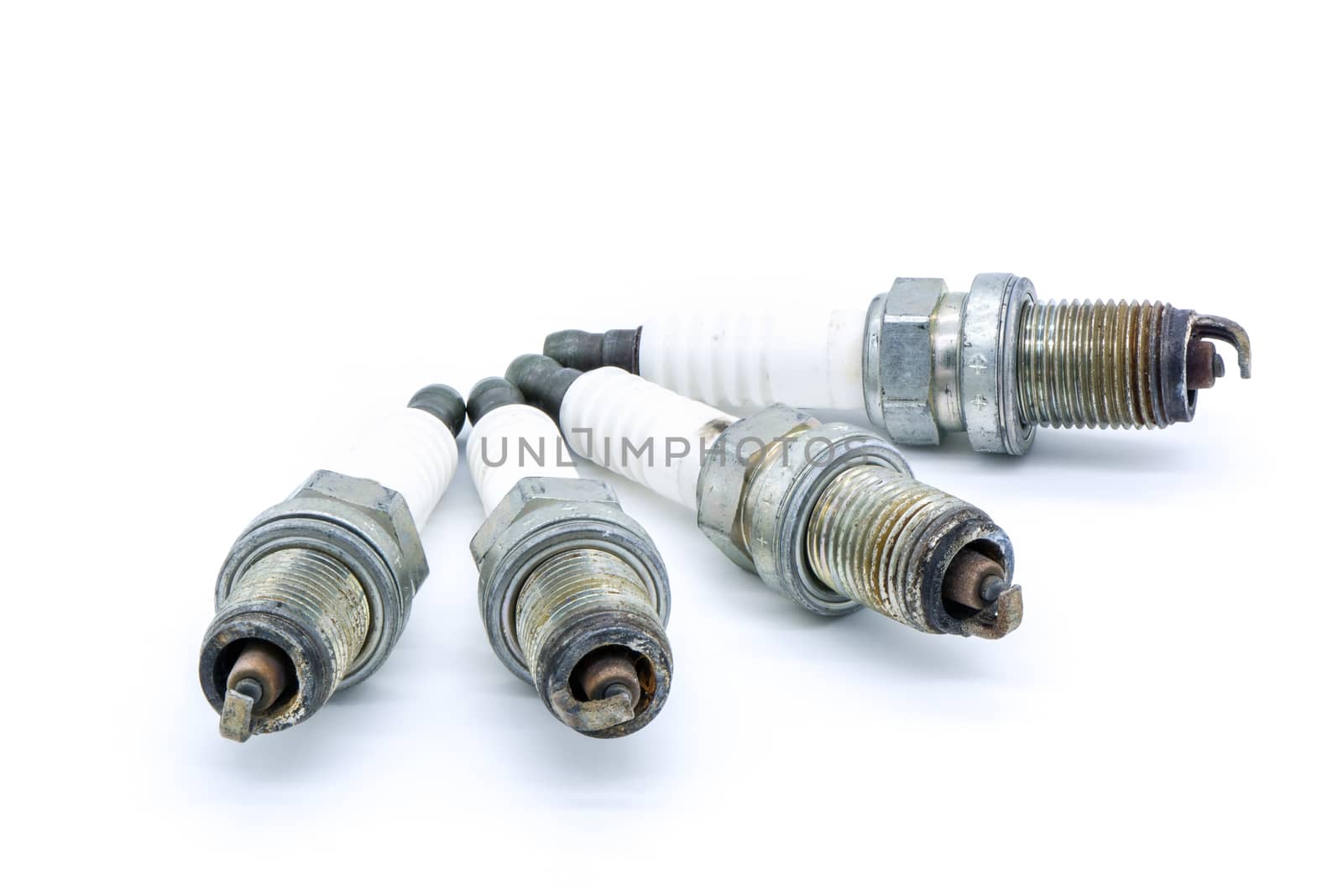 Old spark plug isolated on the white background