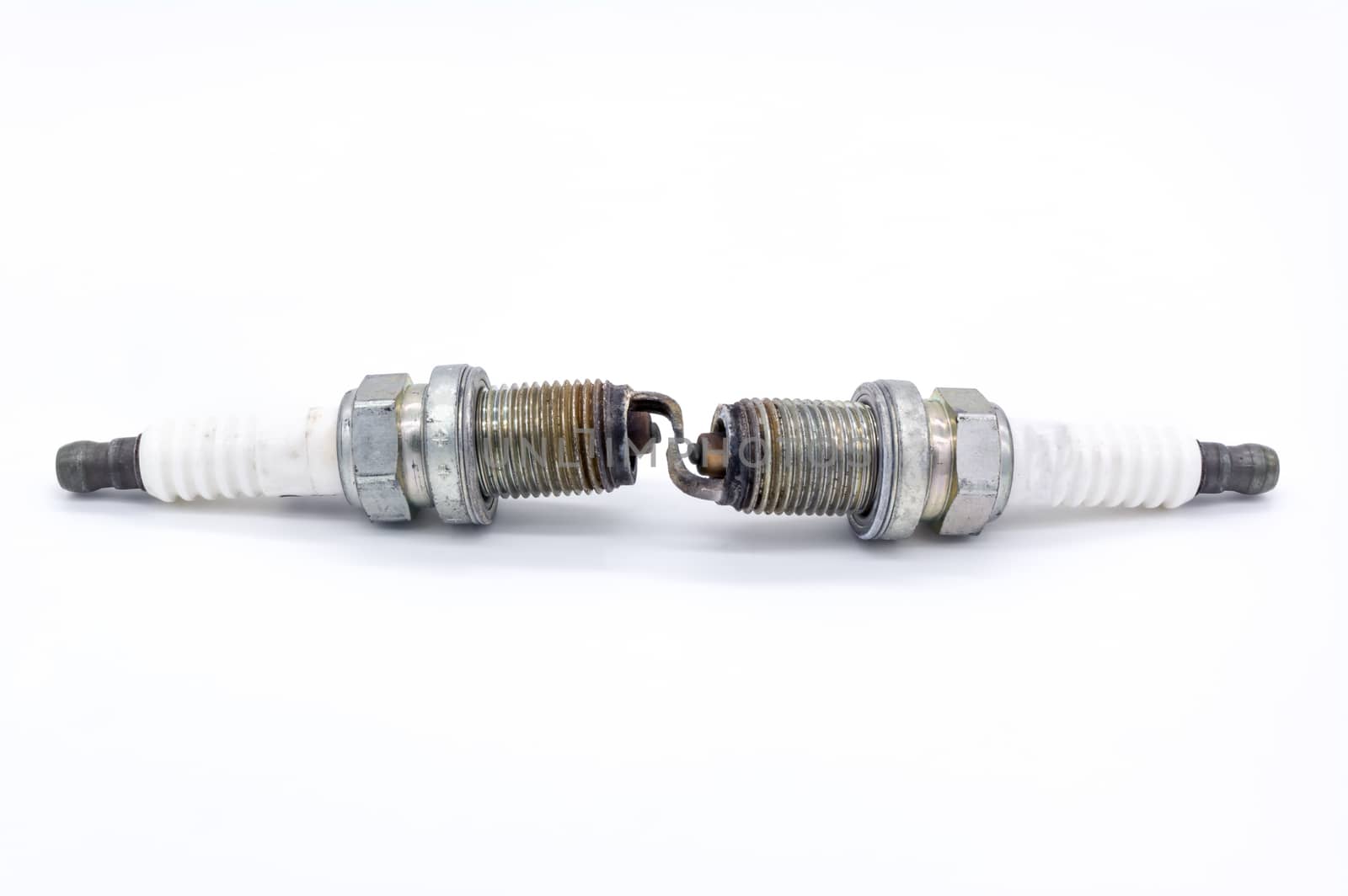 Old spark plug isolated on the white by ahimaone