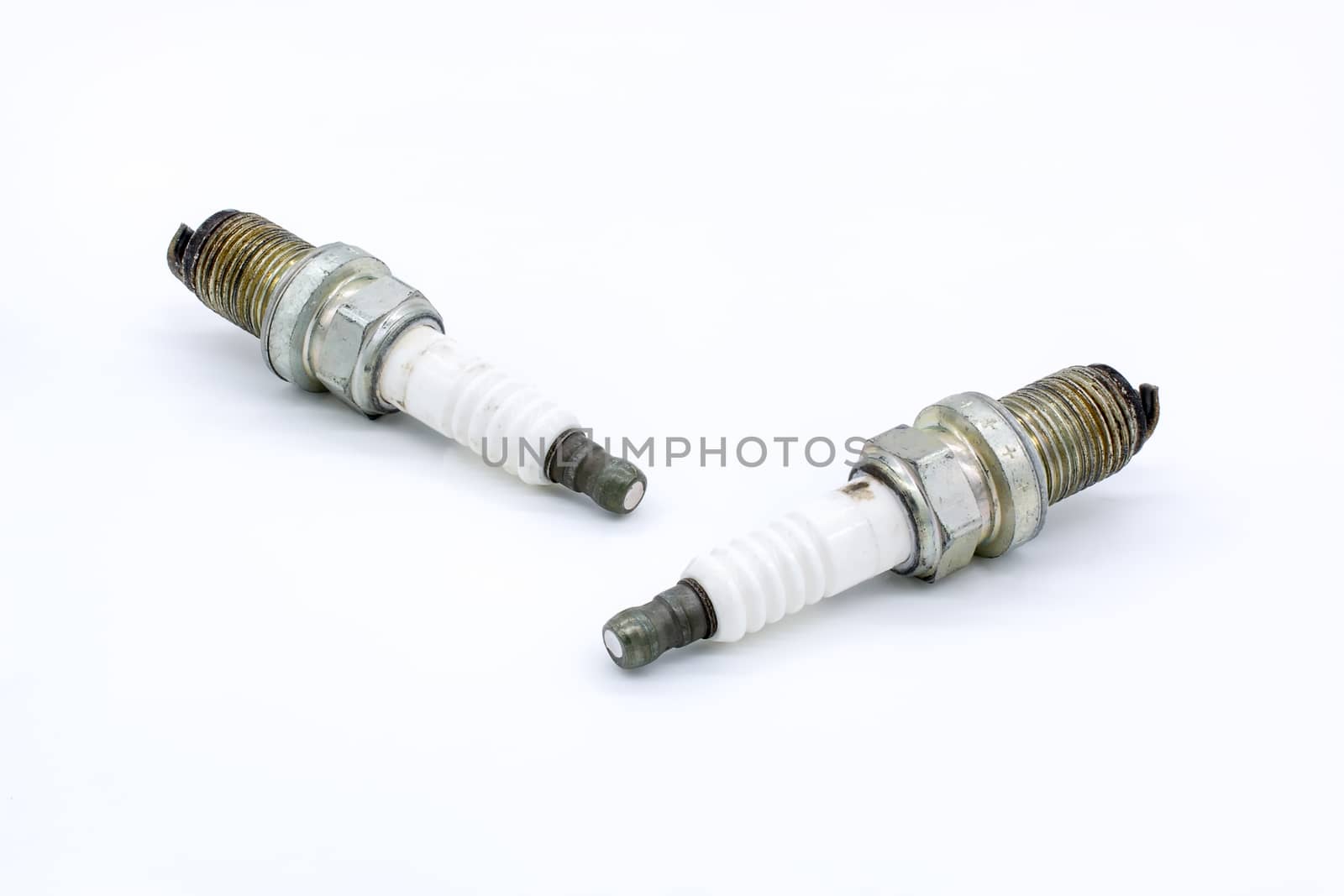 Old spark plug isolated on the white by ahimaone