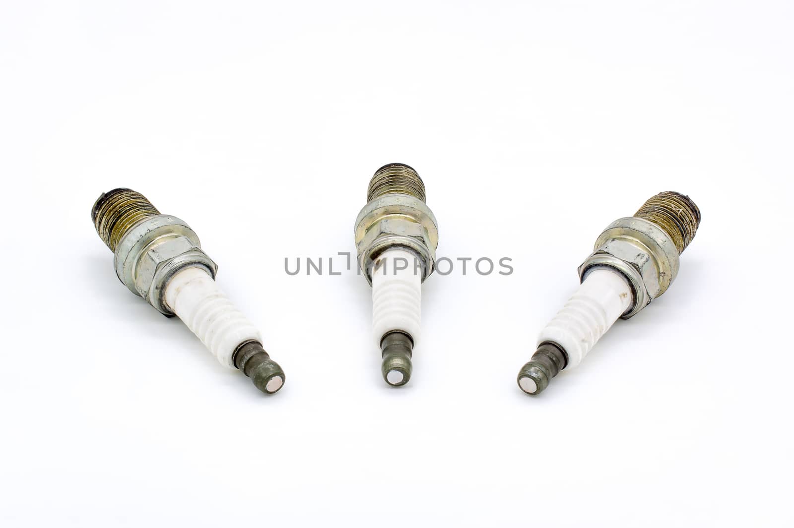 Old spark plug isolated on the white