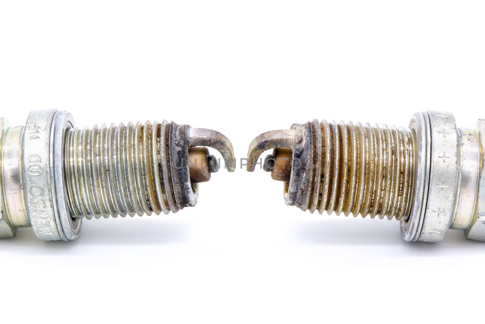 Old spark plug isolated on the white