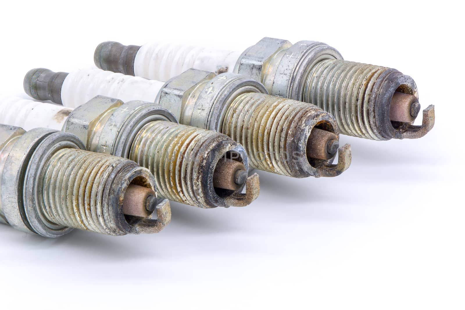 Old spark plug isolated on the white