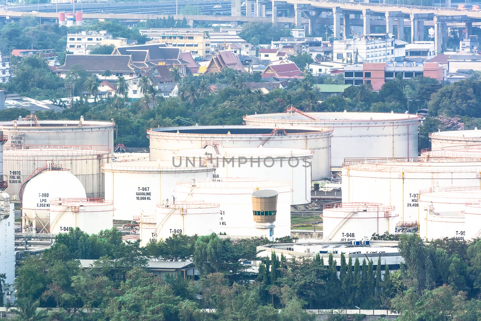 Oil refinery industry And Petrochemical plant with white sky city view