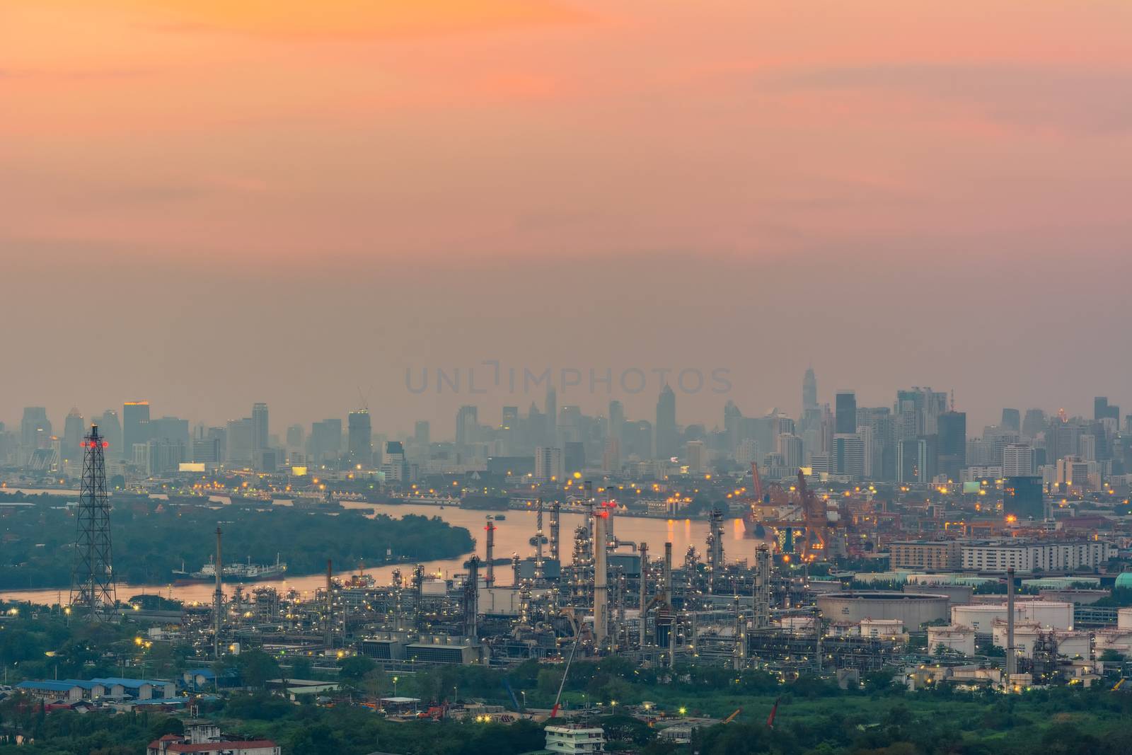 Oil refinery industry And Petrochemical plant with Twilight time city view