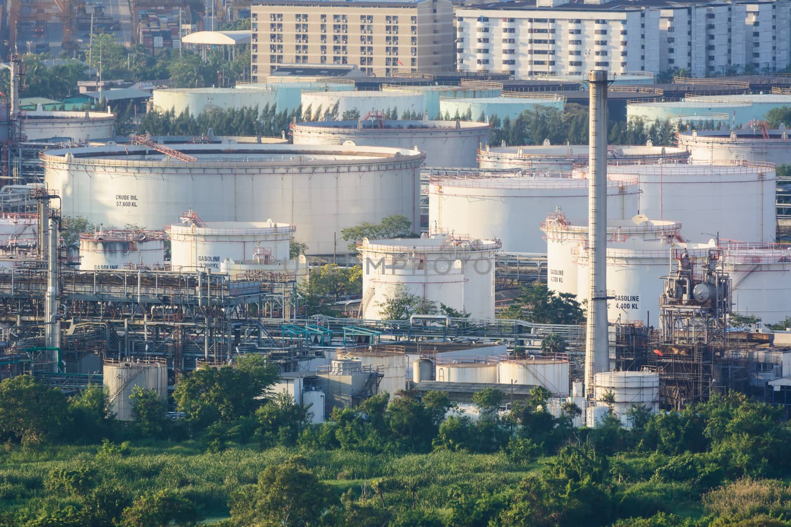 Oil refinery industry And Petrochemical plant in city ,near forest