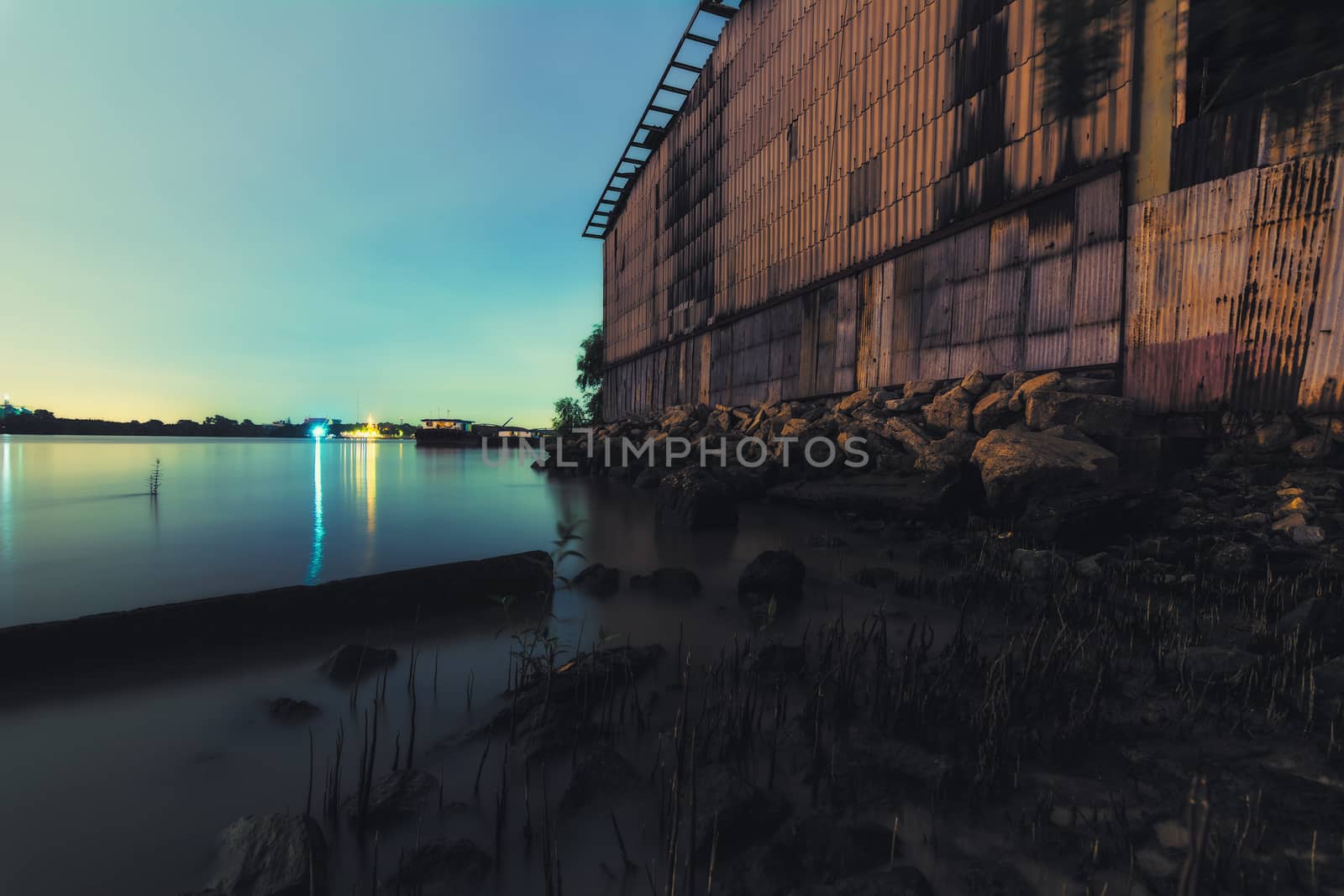 Old Warehouse on the riverside of Chao Praya River in Bangkok, Thailand