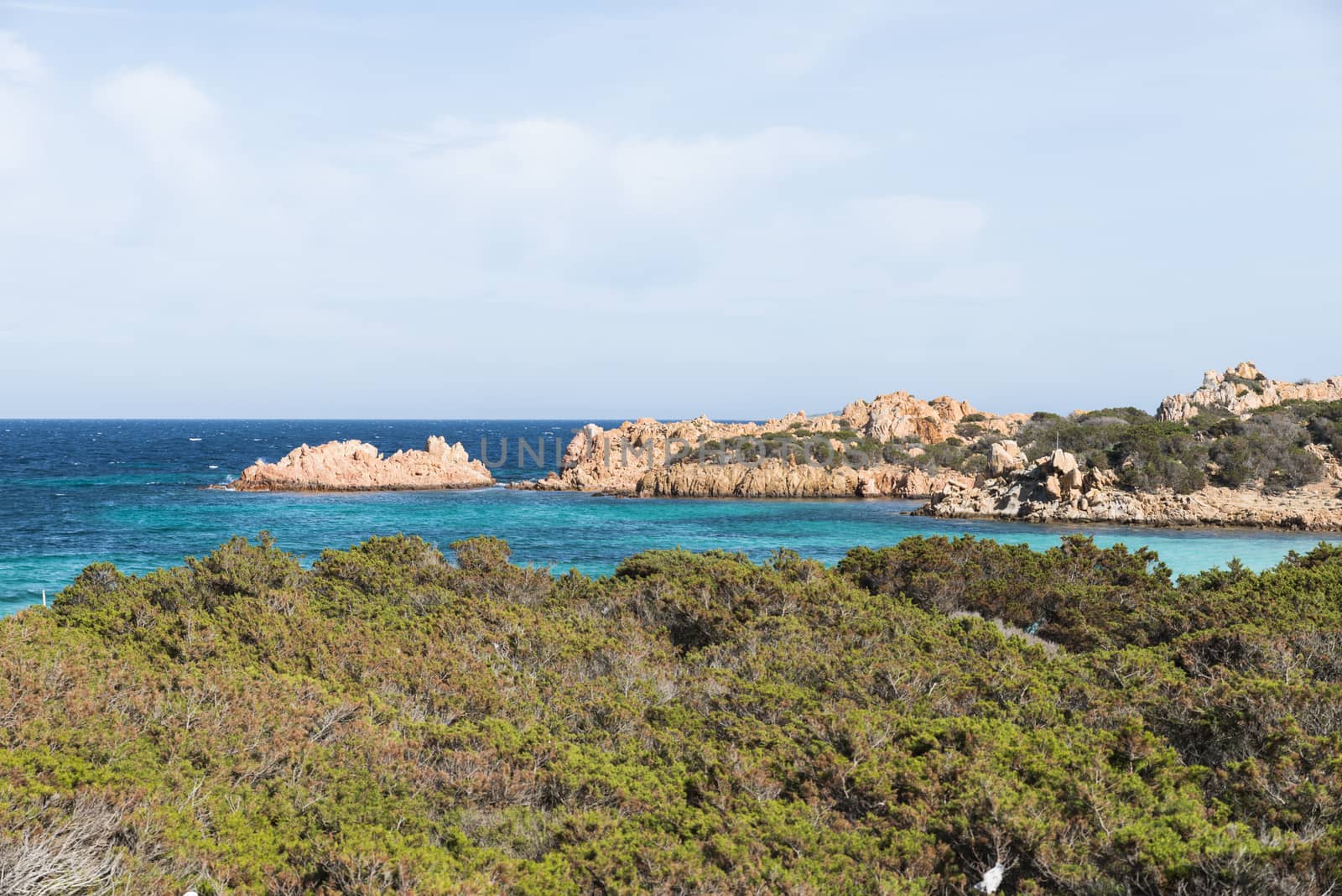 bay with blue water onm ths island of maddalena, you reach the island with the ferry from palu on sardinia
