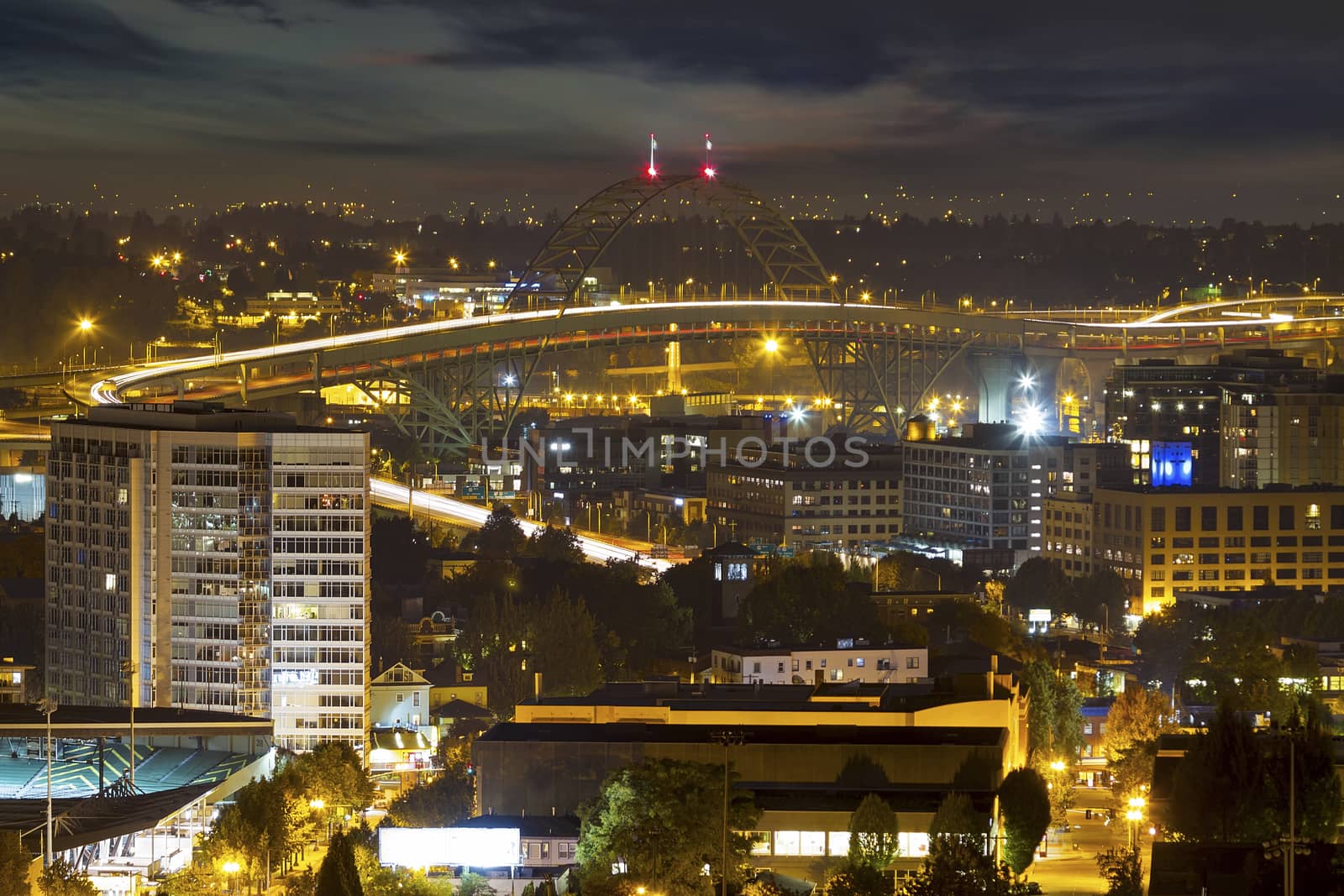 Fremont Bridge and Portland Oregon cityscape light trails at night