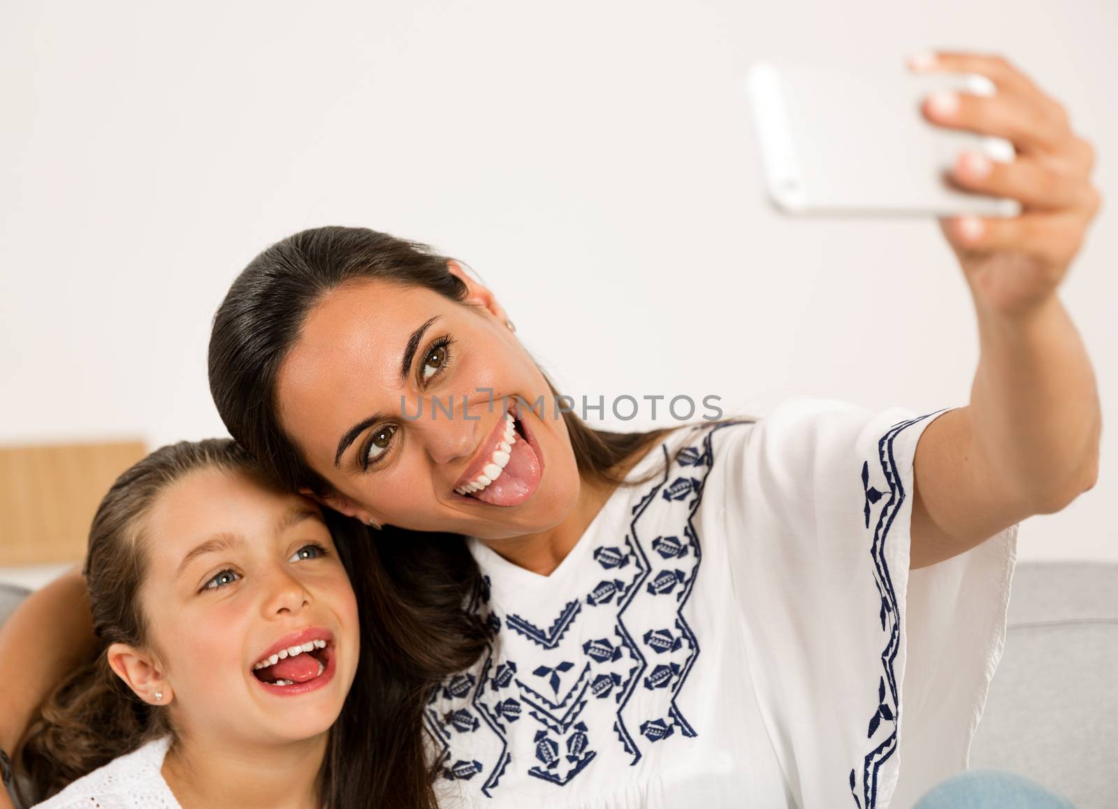Mom and Daughter making a selfie by Iko