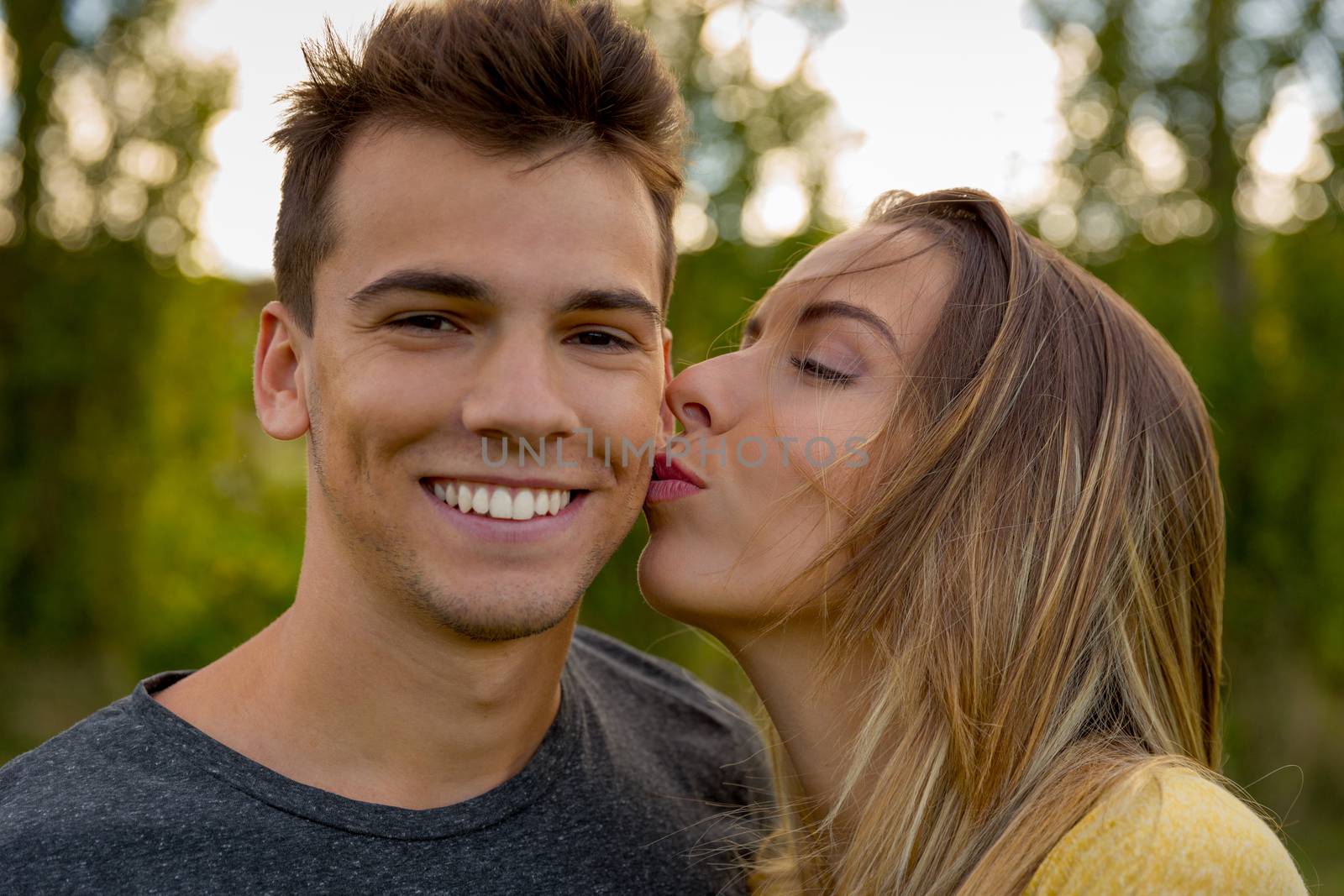 Portrait of a young beautiful couple hugged together