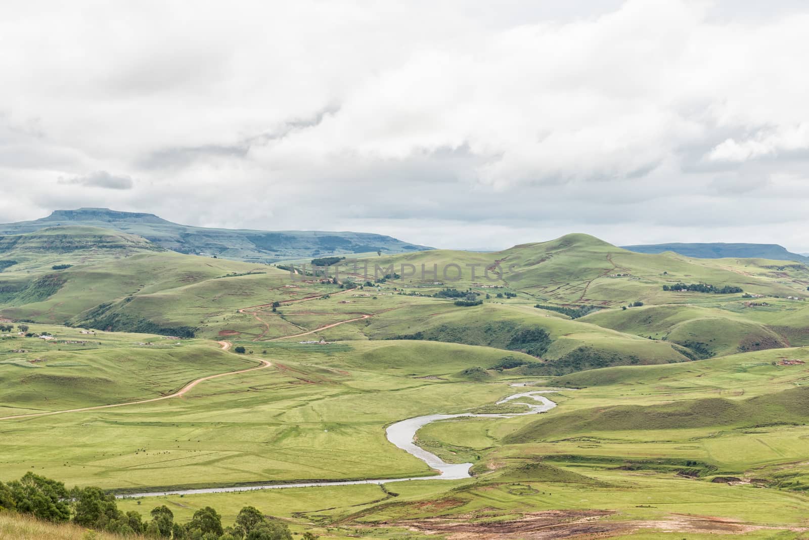 A farm landscape with the Mlambonja River near Cathedral Peak in the Kwazulu-Natal Drakensberg