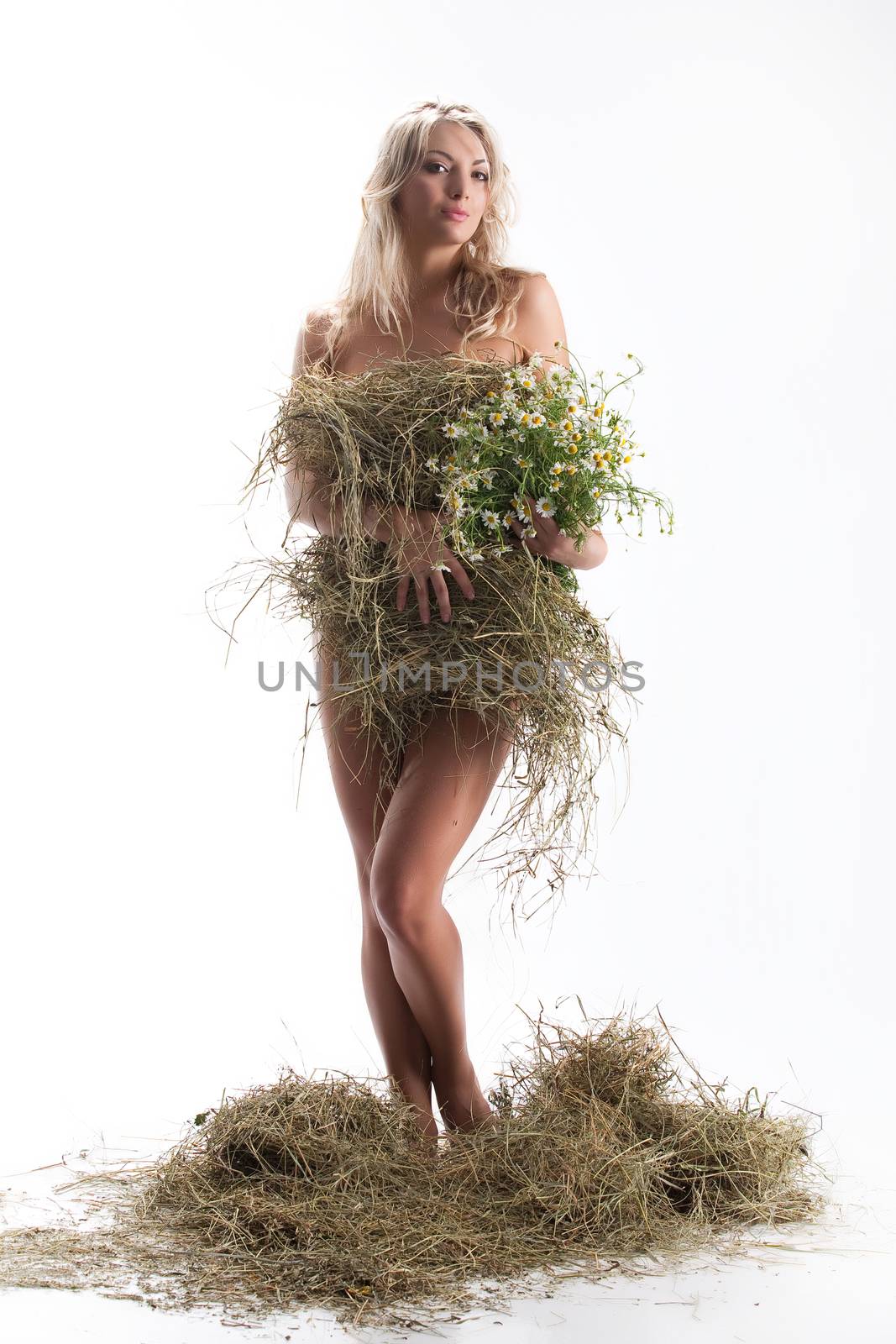 Young beautiful woman with a hay