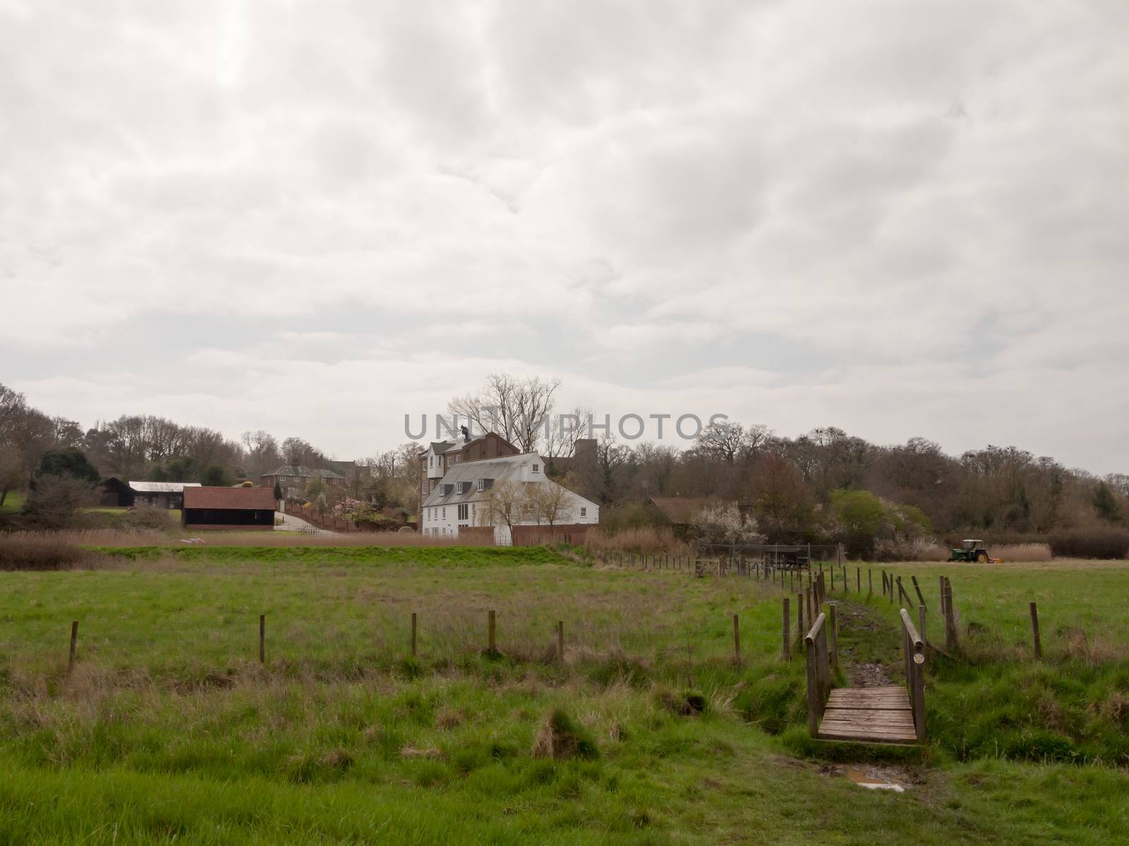 White farm house cottage mansion far off field trail bridge country environment nature by callumrc