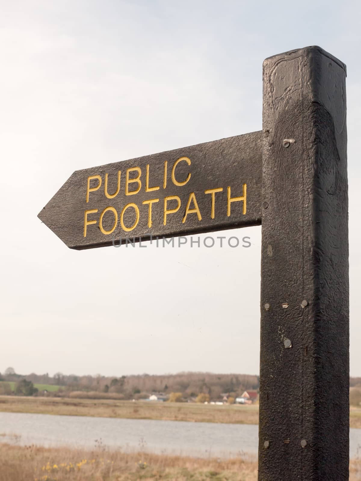 close up of black wooden public footpath sign way trail by callumrc